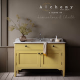 Amber Alchemy Paint by Fusion Mineral Paint with marble top and dried flowers in view.