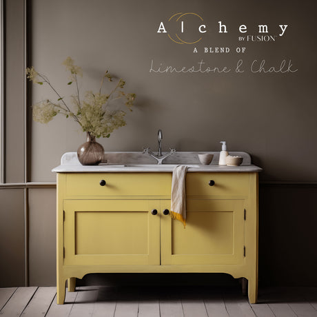 Amber Alchemy Paint by Fusion Mineral Paint with marble top and dried flowers in view.