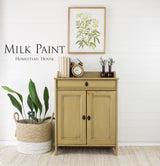 Tan cabinet painted with Homestead House Antique Gold Milk Paint.
