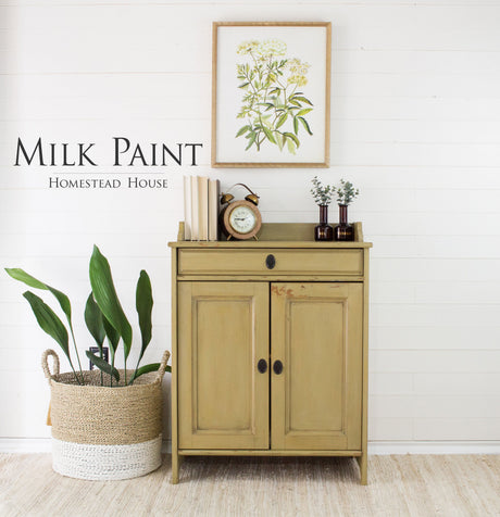 Tan cabinet painted with Homestead House Antique Gold Milk Paint.