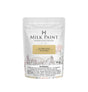 50g bag of Homestead House Antique Gold Milk Paint with warning label and farmhouse wheel illustration.