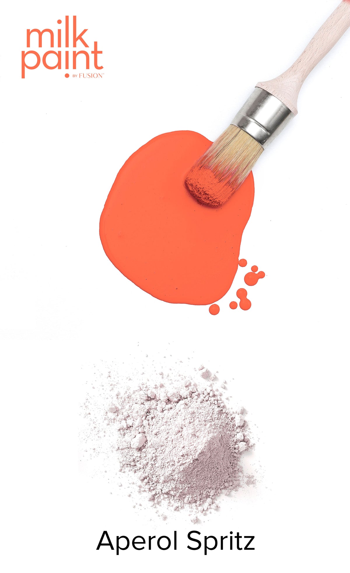 Paintbrush with orange paint, powder, and Fusion Mineral Paint Aperol Spritz Milk Paint on white background.