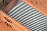 Open orange drawer with black handles, striped lining, and “Autumn Leaves Milk Paint by Homestead House” text overlay.