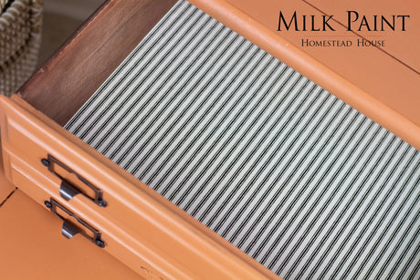 Open orange drawer with black handles, striped lining, and “Autumn Leaves Milk Paint by Homestead House” text overlay.