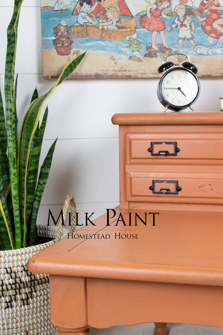 Dresser painted with Autumn Leaves Milk Paint by Homestead House, featuring black hardware.