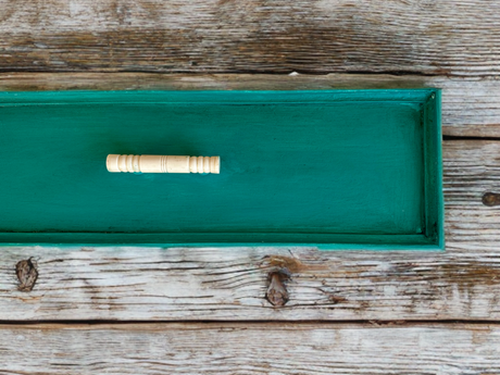 Small wooden spindle finished with DIY Paint Co. Azure DIY Cottage Color at center of tray.