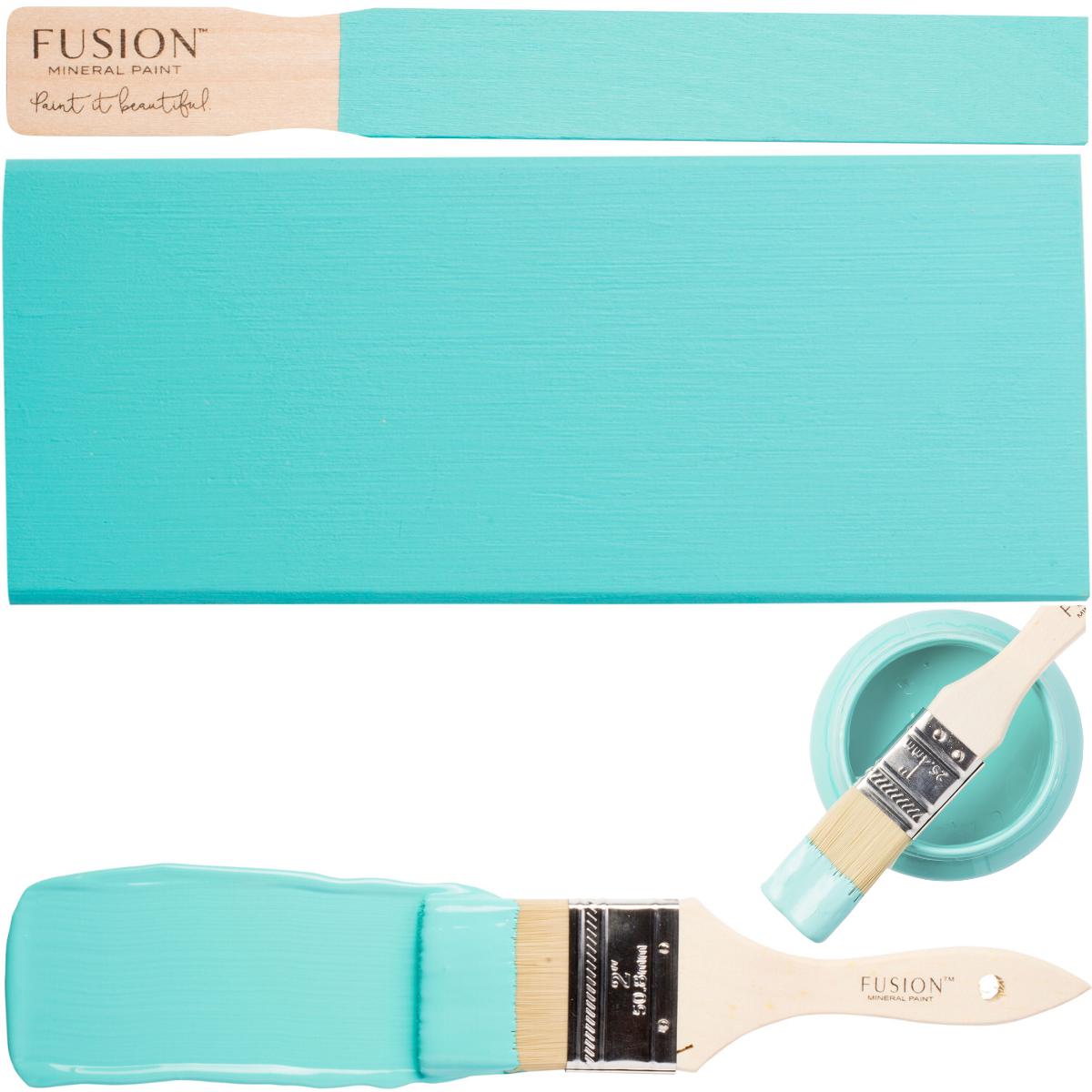 Azure Fusion Mineral Paint jar with paint stirrer, brush, and wood sample.