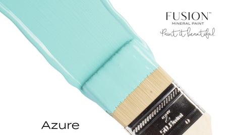 Brush with turquoise paint; text reads “Azure Fusion Mineral Paint by Fusion Mineral Paint, all-in-one acrylic paint.”.