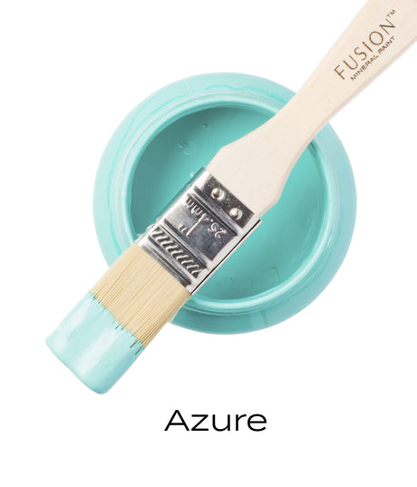 Brush with light blue paint on open jar labeled Azure Fusion Mineral Paint by Fusion Mineral Paint.