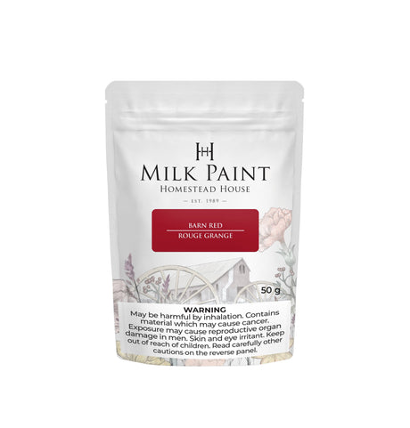 50g Barn Red Milk Paint by Homestead House with warning label and barn plus wagon wheel illustration on packaging.