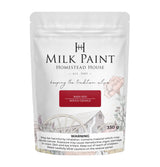 Homestead House Barn Red Milk Paint 330g bag with floral and wagon wheel design, safety info at the bottom.