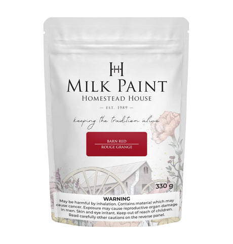 Homestead House Barn Red Milk Paint 330g bag with floral and wagon wheel design, safety info at the bottom.