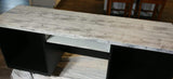 Wooden table with distressed white top, two open shelves, and I.O.D. Barnwood Planks Stamp detailing.