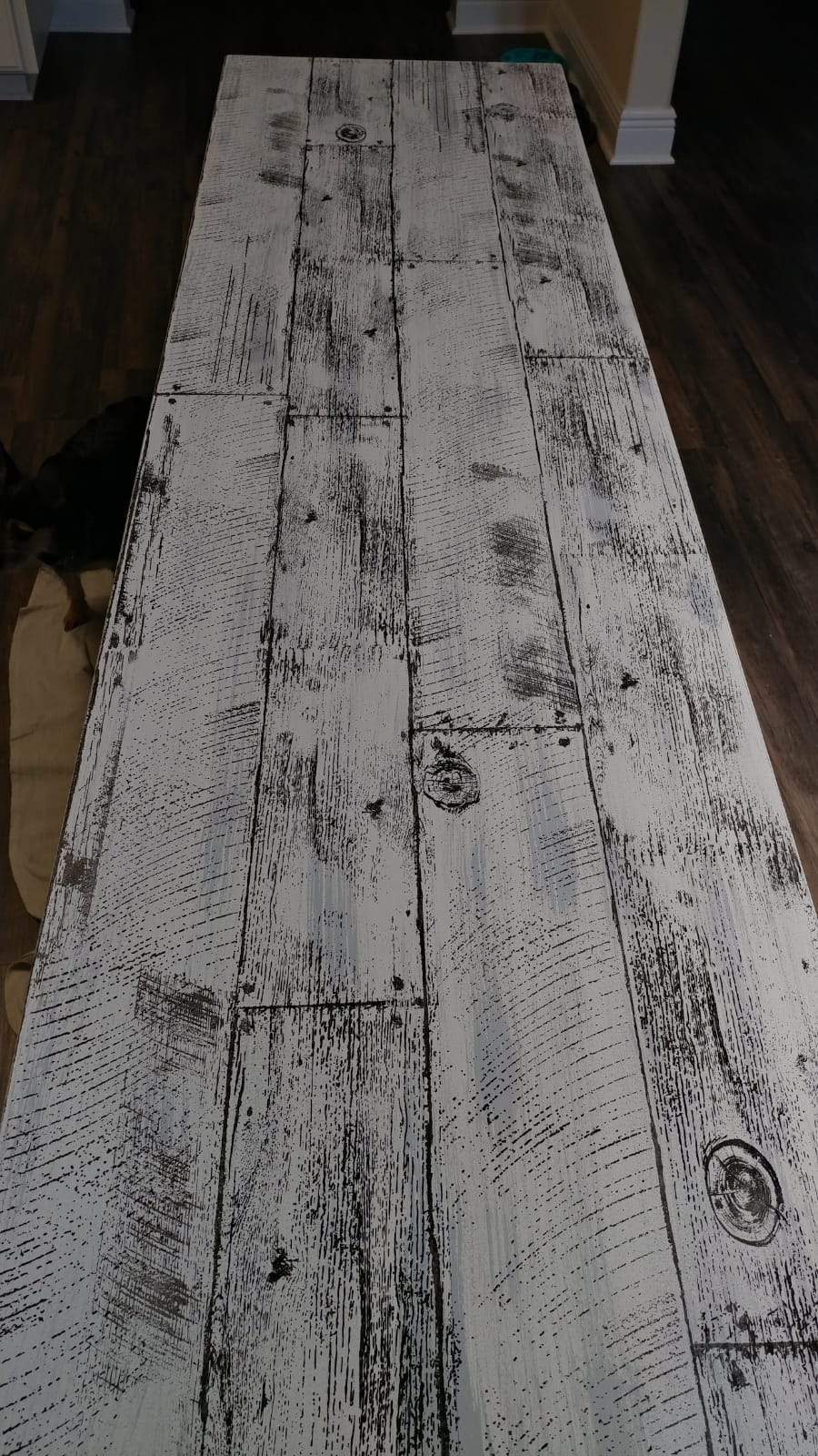 Whitewood table on dark floor, suitable for I.O.D. Barnwood Planks Stamp by Iron Orchid Designs.