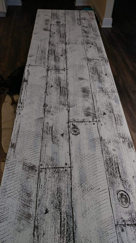 Whitewood table on dark floor, suitable for I.O.D. Barnwood Planks Stamp by Iron Orchid Designs.