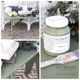 Fusion Mineral Paint Bayberry jar, paintbrush, olive decor, and green table arranged together.
