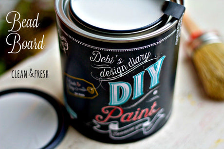 Open can of DIY Paint Co. Bead Board paint with brush.