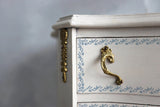 White drawer with gold accents, blue floral design, and I.O.D. Bella Stamp (Retired) by Iron Orchid Designs.
