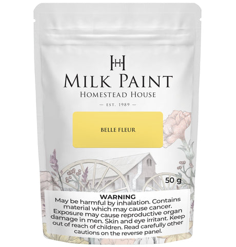 Belle Fleur Milk Paint by Homestead House, 50g bag with rustic floral pattern and visible warning label.