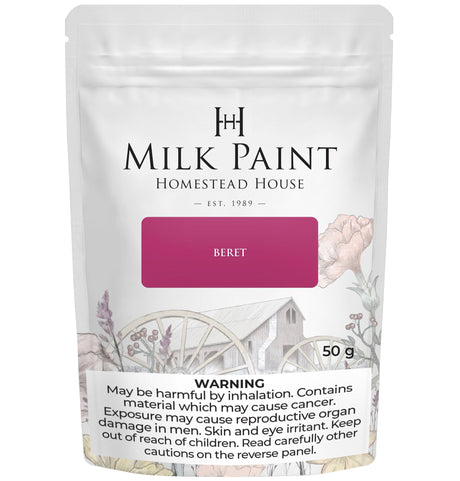 Homestead House Beret Milk Paint 50g pouch with health warnings and a floral cottage design on the label.