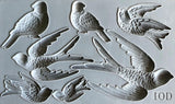 Gray silicone I.O.D. Birdsong Mould featuring 7 bird designs for Iron Orchid Designs décor projects.