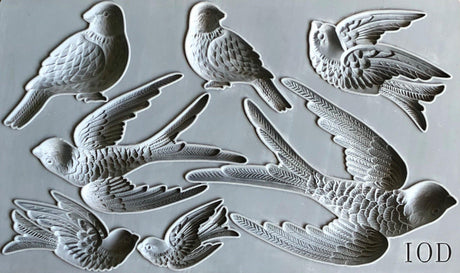 Gray silicone I.O.D. Birdsong Mould featuring 7 bird designs for Iron Orchid Designs décor projects.