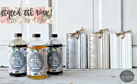 Three Black Oil Wax bottles by Old Fashioned Milk Paint displayed together, intended for wood finishing or sealing.