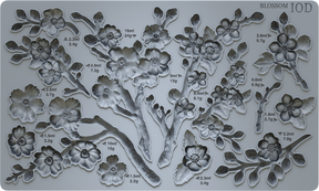 Silicone Blossom Mould by I.O.D. featuring cherry blossom shapes plus labeled volume and weight measurements.