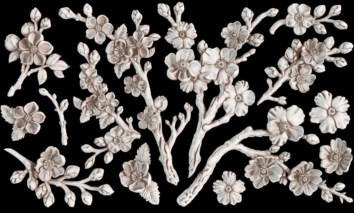 I.O.D. Blossom Mould cream branch designs on bold black background, inspired by Iron Orchid Designs.
