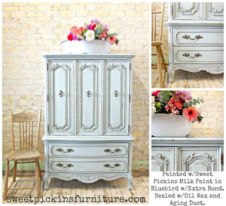 Bluebird armoire with ornate floral top, painted in Old Fashioned Milk Paint, chair positioned beside it.