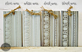 Four Bluebird by Old Fashioned Milk Paint wood samples with clear, white, dark, and black wax finishes, tied with twine.