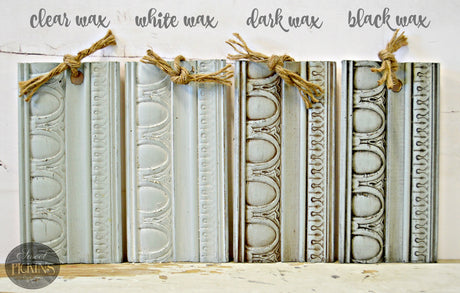 Four Bluebird by Old Fashioned Milk Paint wood samples with clear, white, dark, and black wax finishes, tied with twine.