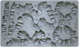 I.O.D. Bows Mould: gray silicone tray with bow shapes, each marked by volume and weight, by Iron Orchid Designs.