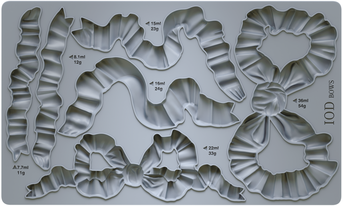 I.O.D. Bows Mould: gray silicone tray with bow shapes, each marked by volume and weight, by Iron Orchid Designs.