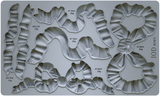 I.O.D. Bows Mould: gray silicone tray with bow shapes, each marked by volume and weight, by Iron Orchid Designs.