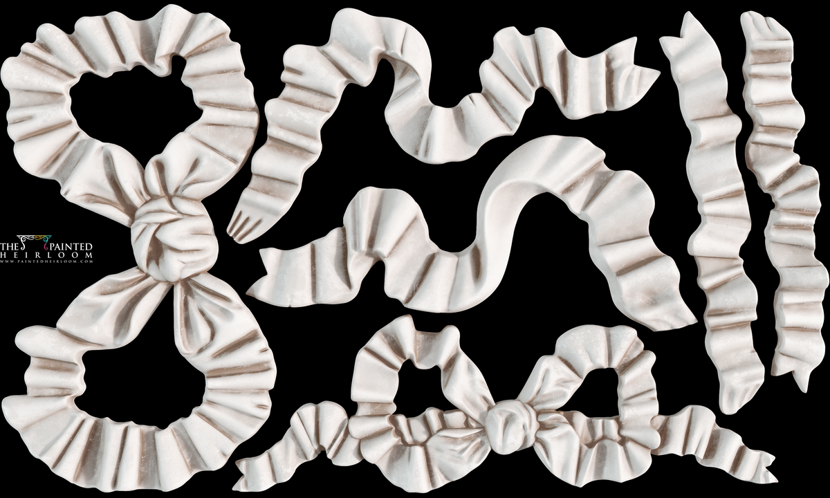 Seven white Bows Mould by I.O.D. ribbon pieces arranged on a black background.