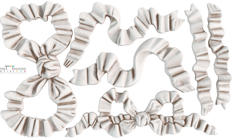 White satin bows and ribbons made with I.O.D. Bows Mould by Iron Orchid Designs on a white background.