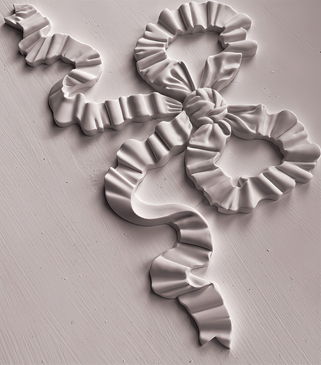 Ruffled bow made with Bows Mould by IOD, displayed flat on a light surface.