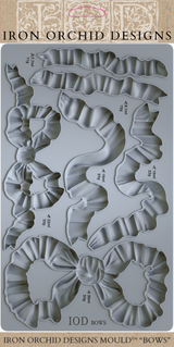 I.O.D. Bows Mould by Iron Orchid Designs, silicone tray with 6 bow-shaped cavities for crafting.