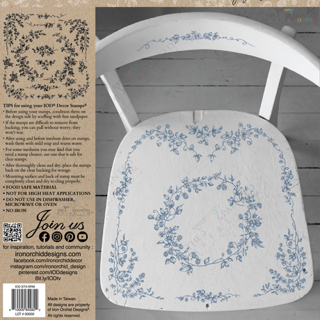 White chair with blue Brambles & Berries Stamp florals by I.O.D.; decorating tips visible on the left side.