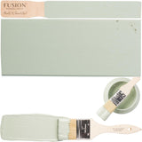 Brook Fusion Mineral Paint, paintbrush, and sage green painted wood sample.