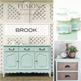 Sideboard and nightstand painted in Fusion Mineral Paint Brook, a vibrant tropical blue-green.
