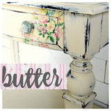 Distressed ivory table leg with floral drawer, painted Butter by Old Fashioned Milk Paint.