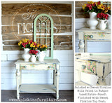 Vintage table with floral stencil, shown in Butter by Old Fashioned Milk Paint’s Sweet Pickins line, with vase on top.