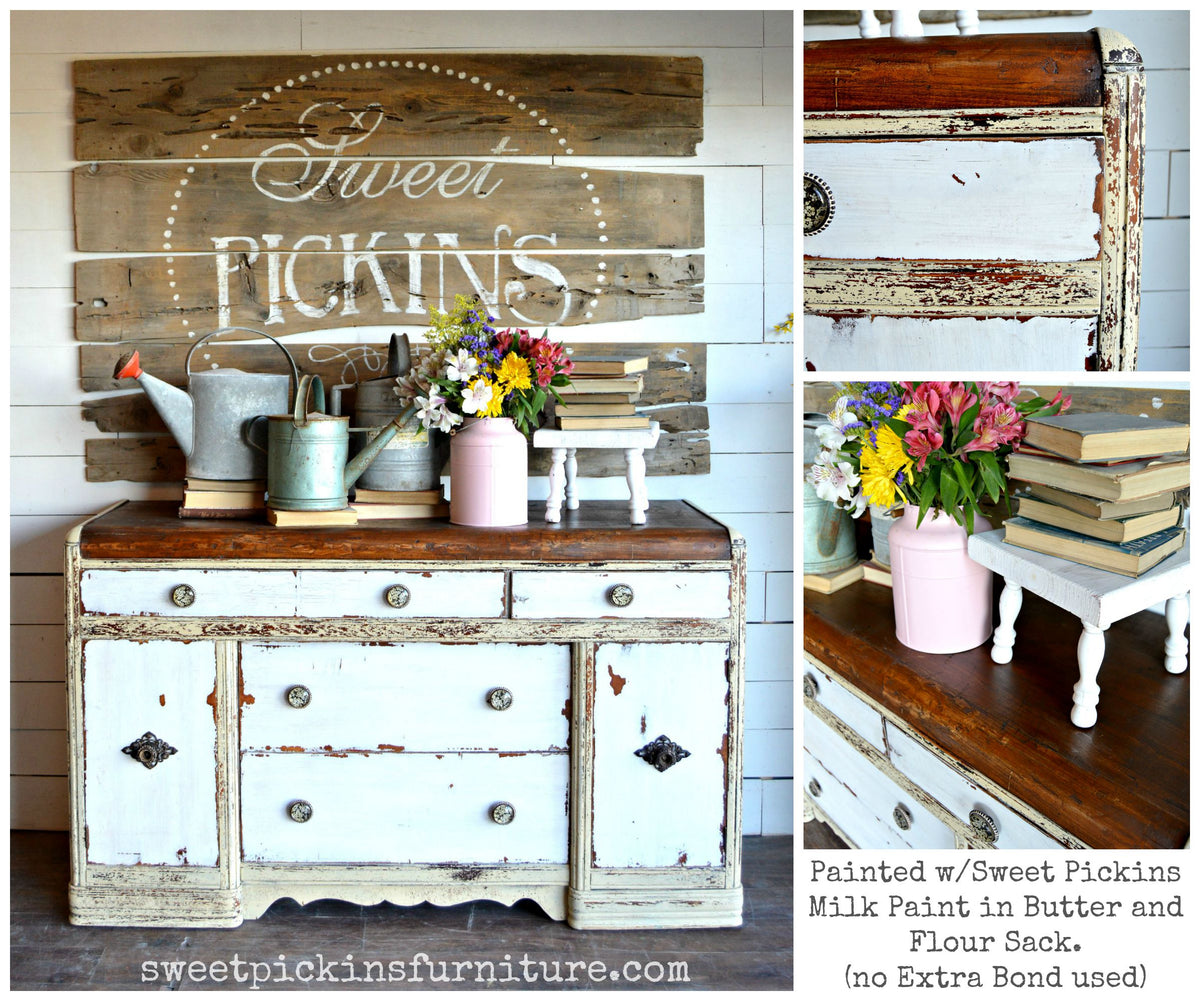 Distressed white sideboard with wood top, pink vase, and sign, painted Butter by Old Fashioned Milk Paint.