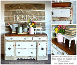 Distressed white sideboard with wood top, pink vase, and sign, painted Butter by Old Fashioned Milk Paint.