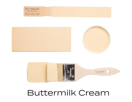 Four Buttermilk Cream Fusion Mineral Paint samples shown on brushes, paint swatches, and in a cup.