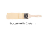 Brush with Fusion Mineral Paint Buttermilk Cream (Seasonal) on white, showing creamy yellow paint finish.