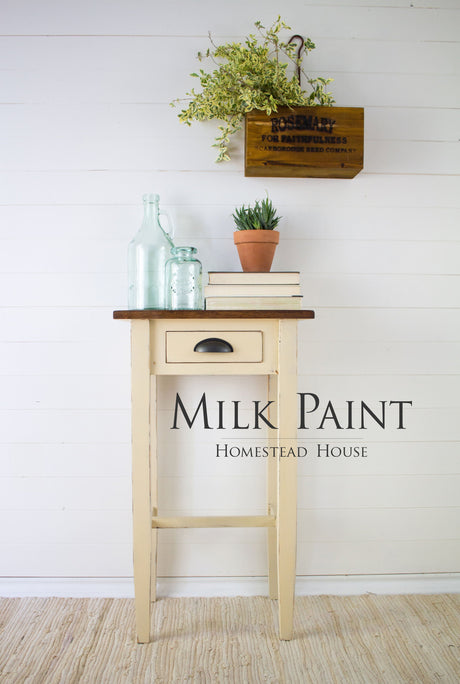 Buttermilk Cream Milk Paint small table by Homestead House with books and greenery on top.