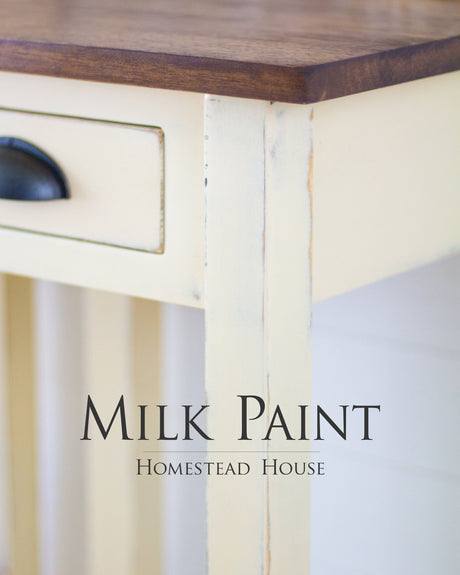 Cream table finished in Buttermilk Cream Milk Paint by Homestead House, shown in close detail.